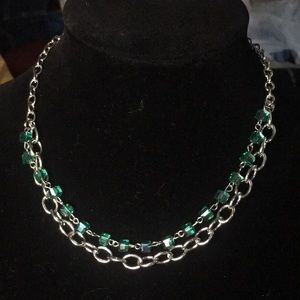 Silver necklace with green beads and earrings